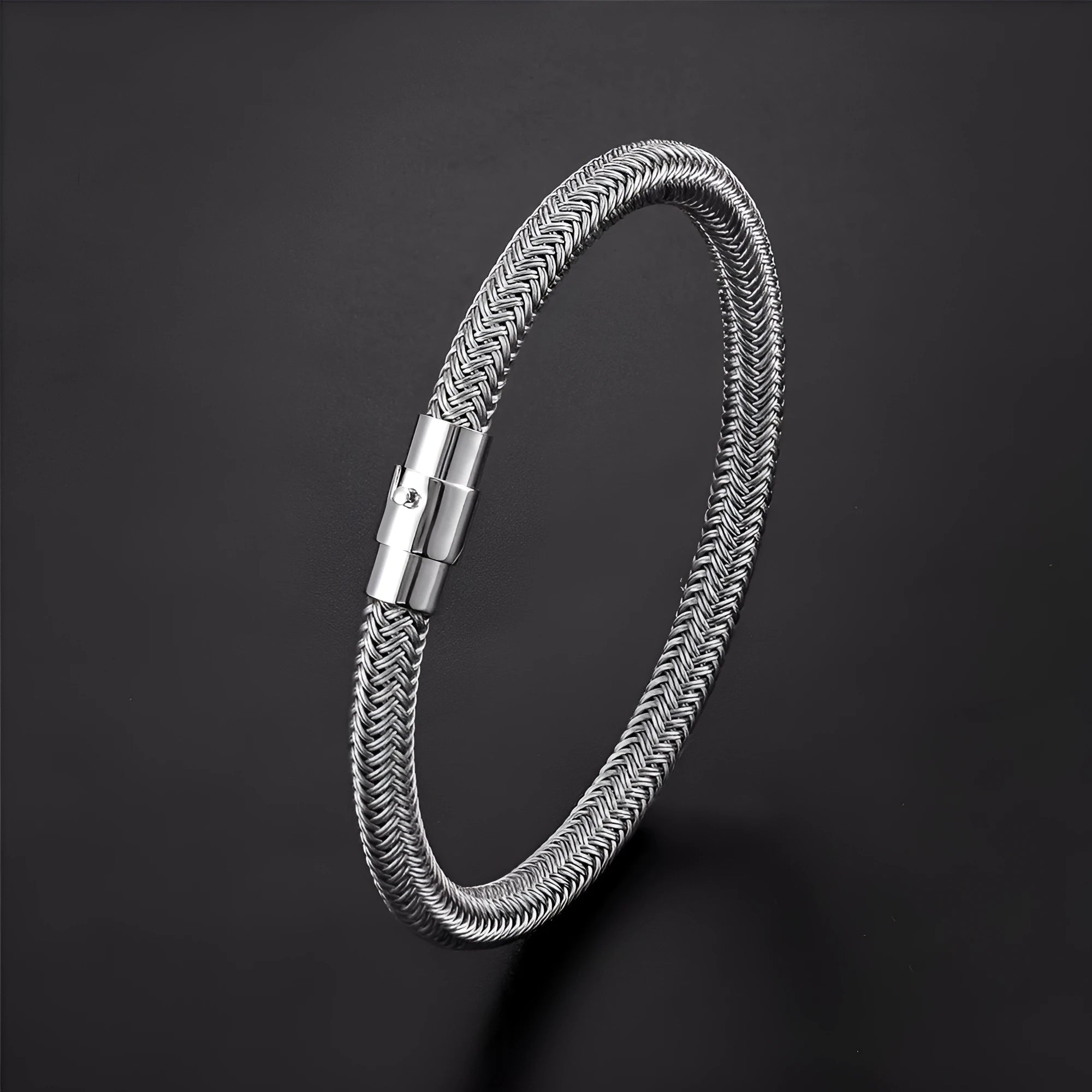 Titanium steel wire bracelet with magnetic clasp in a geometric line design on a wrist.