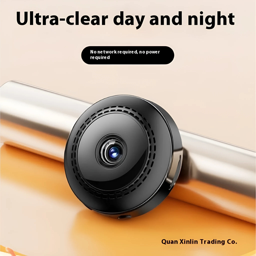 Wireless 360-degree rotating security camera on a table, showing circular design.