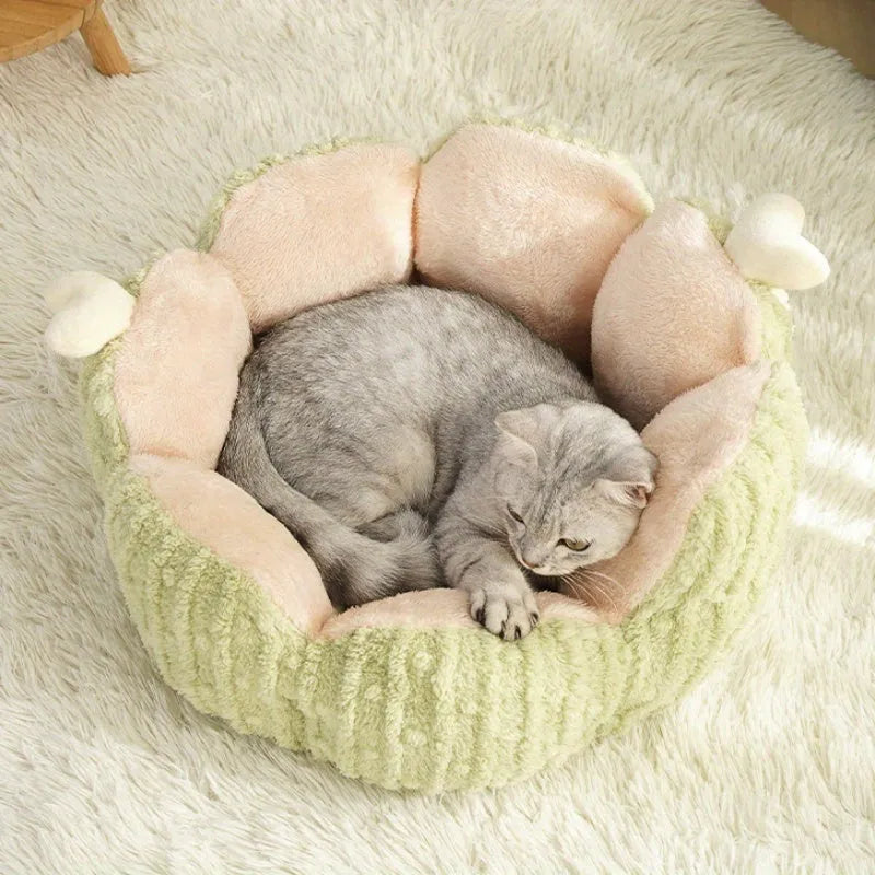 Green cactus-patterned cat litter mat with non-slip backing placed under a litter box