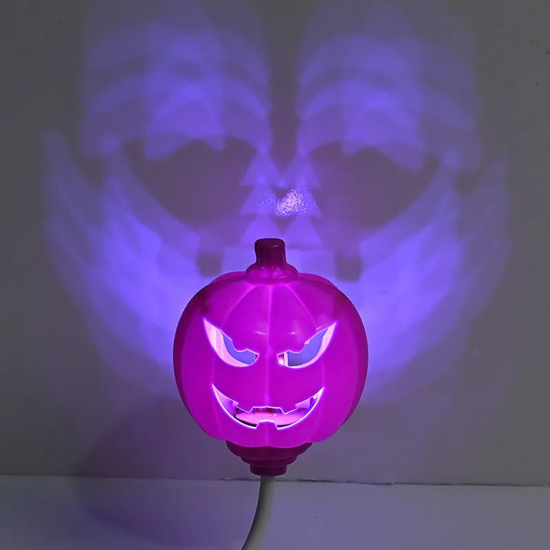 Plastic pumpkin-shaped decorative lamp with USB charging cable, showing purple or yellow light option.