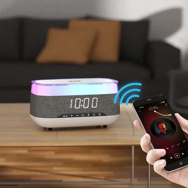 White multifunctional alarm clock with Bluetooth speaker and wireless charging pad