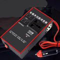Black automotive power converter with UK 3-pin socket and four USB ports for 12V/24V vehicles.