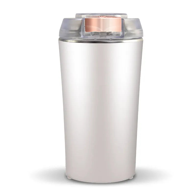 Blue mini flour mill and grinder machine with stainless steel chamber for making spice powder.