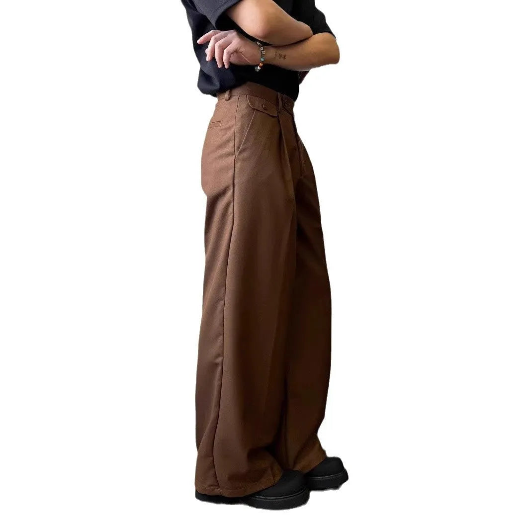 Brown men's wide-leg straight trousers with a draping casual suit style on a hanger.