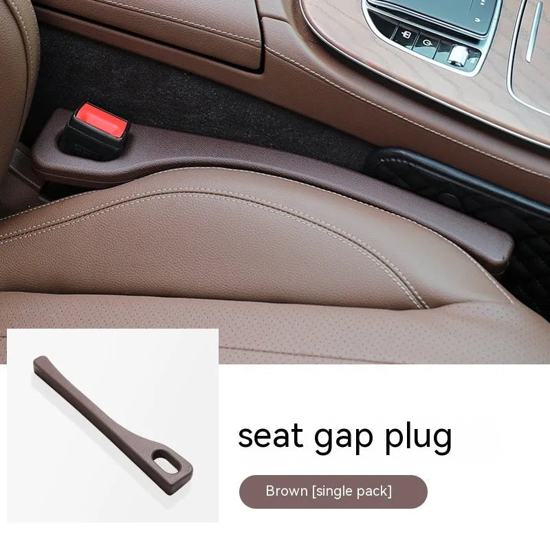Black polyurethane car seat gap strip preventing items from falling between vehicle seats.