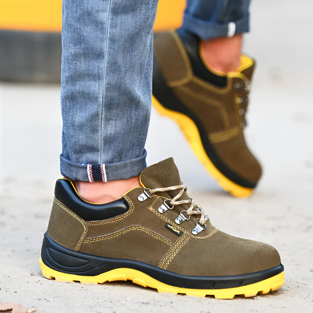 Bronze cow suede unisex safety work boots with a steel toe cap and patterned non-slip sole.