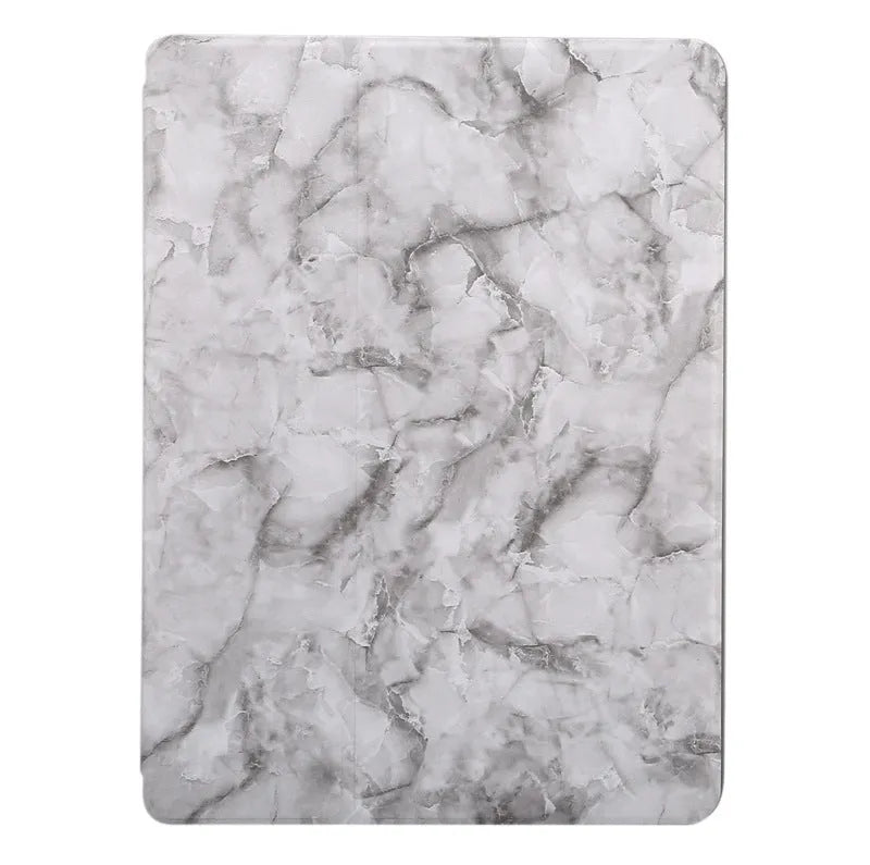 Dark grey marbling pattern iPad case folded in a stand position, showing the Apple Pencil slot.