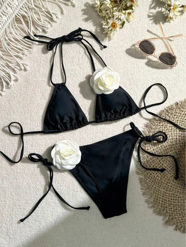 Black women's bikini swimsuit with 3D flower lace detailing and backless split design