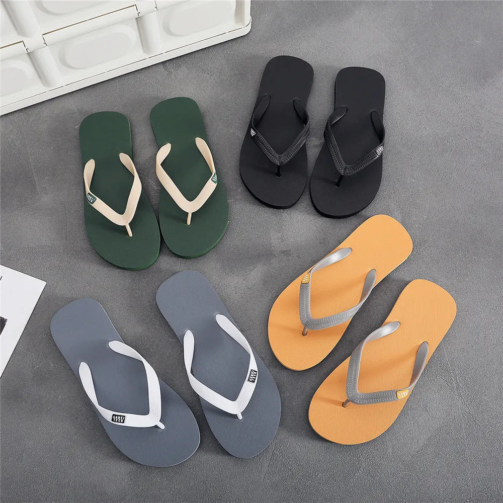 Men's black flip-flop slippers with EVA upper and rubber sole on a plain background.