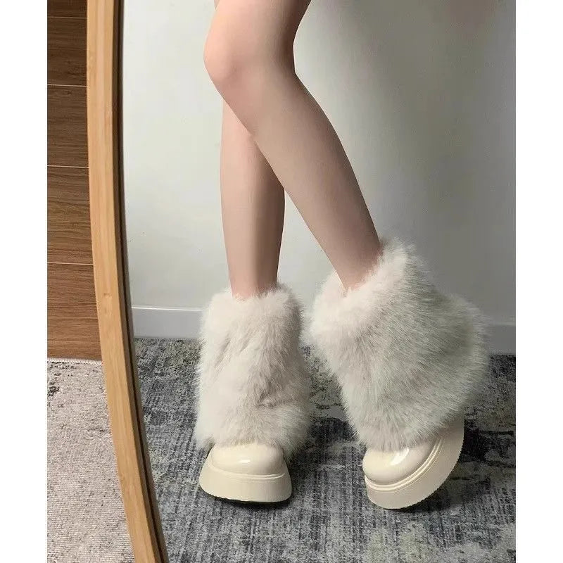 Women's black fleece-lined low-top snow boots with a waterproof rubber platform sole on a white background.
