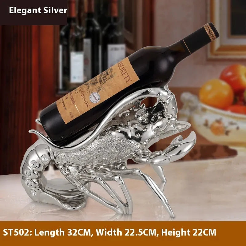 Decorative lobster-shaped wine rack ornament in rose gold or silver resin and plastic on a tabletop.