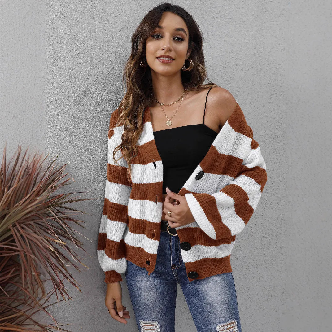 Woman wearing a blue striped cardigan sweater with buttons, showcasing the deer plush fabric texture.