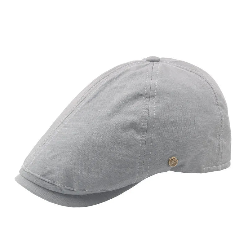 Plaid men's flat cap with copper button in cotton linen, distressed finish, adjustable fit, solid colour collection