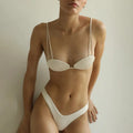 Women's solid colour polyester bikini set with hanging tube top and briefs, available in white or cyan, sizes S to XL.