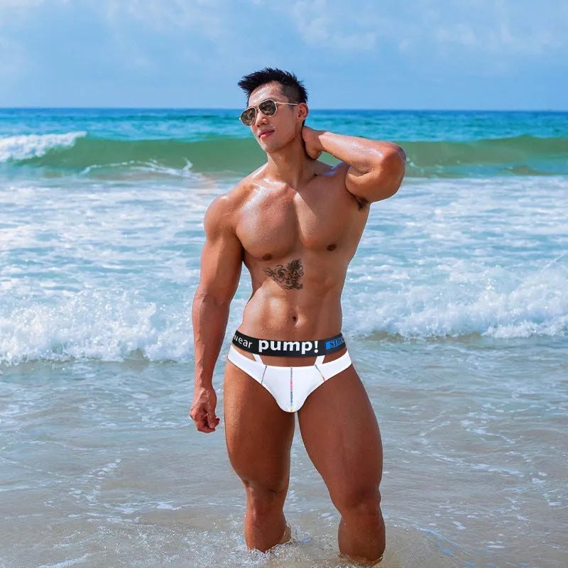 Men's solid black low-waist modal fabric briefs laid flat, showing the waistband and leg openings.
