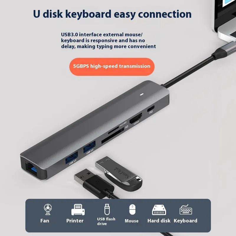 LQT-LH07 7-in-1 USB-C computer hub with card readers and charging port on a desk.