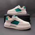 A pair of white and green casual shoes with a cloth upper and rubber foam sole, shown on a plain background.