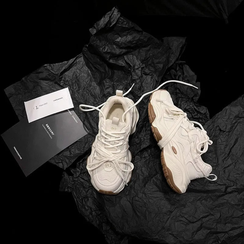 Milky white women's platform heel dad sneakers with round toe and front laces on a solid background.