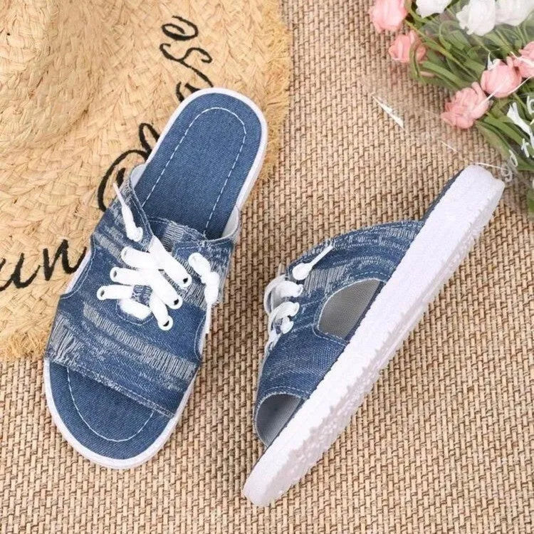 Blue Roman-style women's canvas slippers with flat design and rubber sole