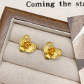 Retro style flower earrings for women in gold or silver finish with petal detailing