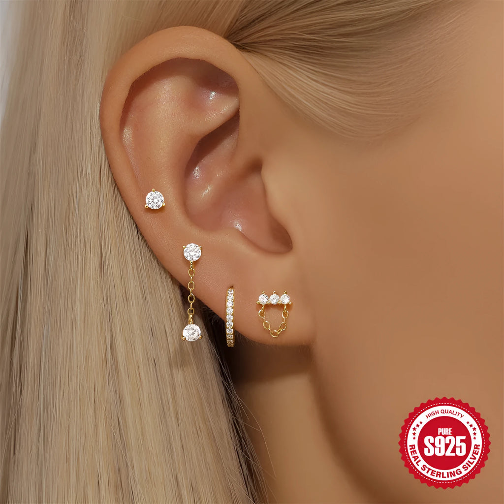 Geometric clover petal earrings in sterling silver with electroplated gold finish.
