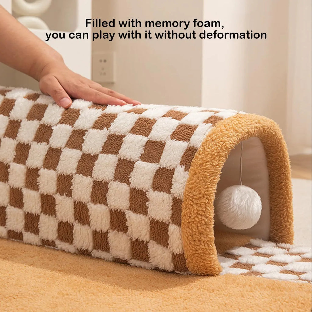 Coffee coloured plush 2-in-1 pet bed with a sleeping mat and an attached tunnel, showing anti-slip base.