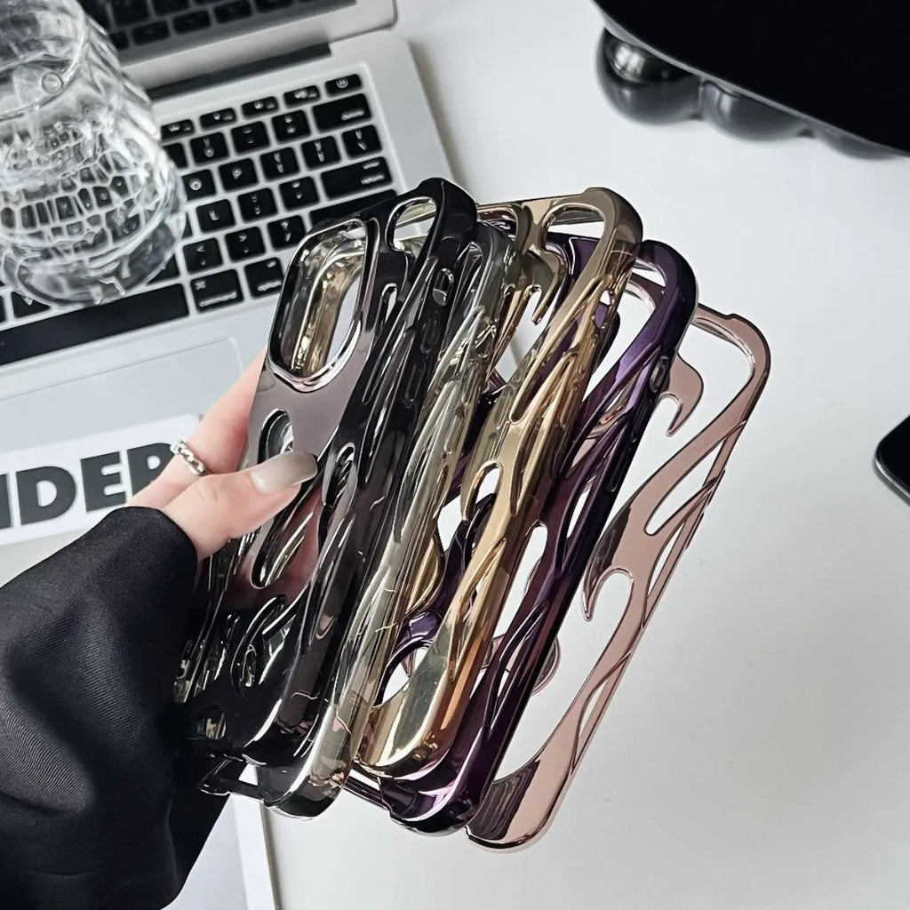 Electroplated hollow flame pattern soft TPU phone case for Apple iPhone on a table.