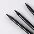 Set of six graphite pencils and three carbonized pencils with wooden shells on suction card packaging
