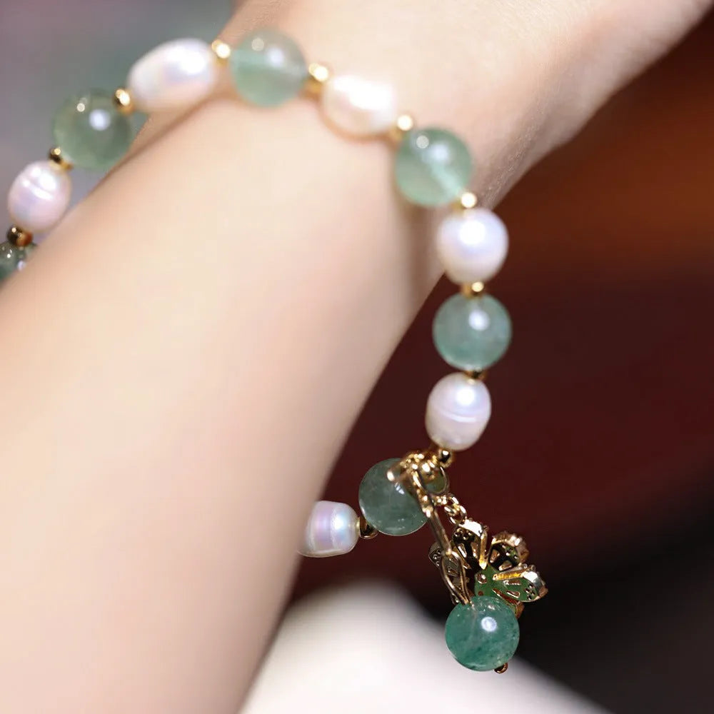 Green handmade freshwater pearl bracelet with strawberry pearls and Chinese knot design
