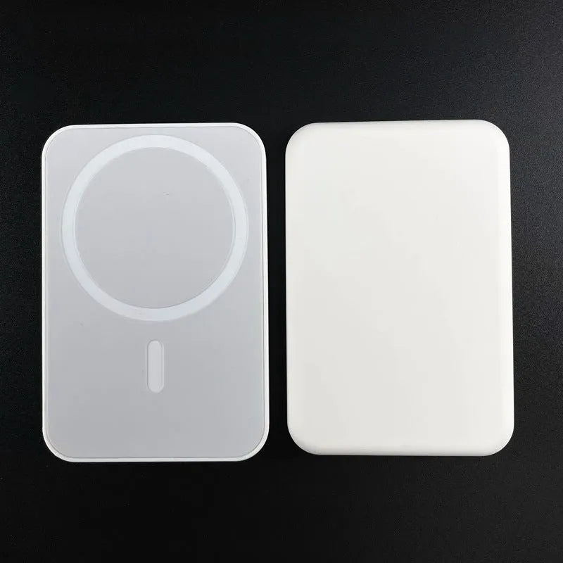 White magnetic wireless charging power bank with 5000mAh capacity on a table.
