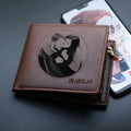 Men's brown leather zip wallet presented in gift packaging