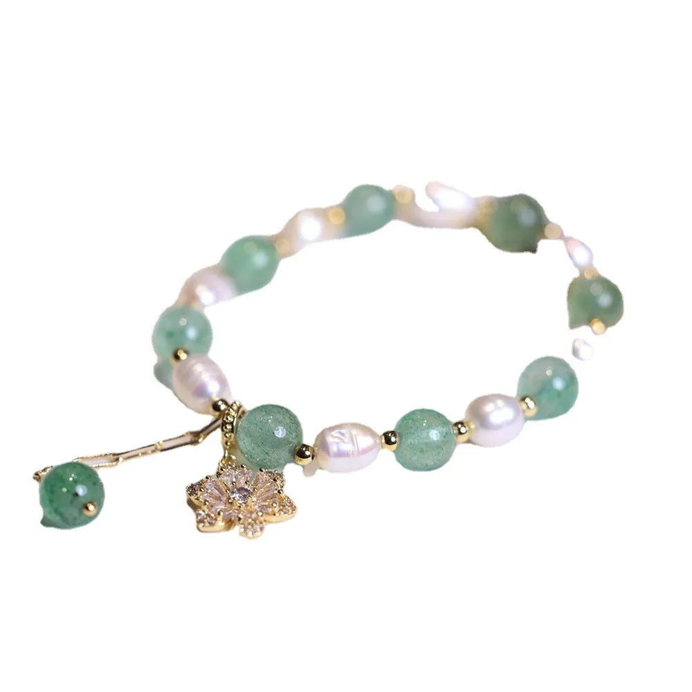 Green handmade freshwater pearl bracelet with strawberry pearls and Chinese knot design