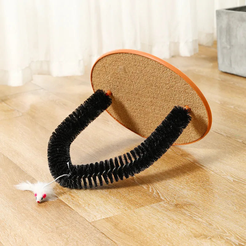 Black arch-shaped cat grooming brush with scratching surfaces and attached plush mouse toy on non-slip base