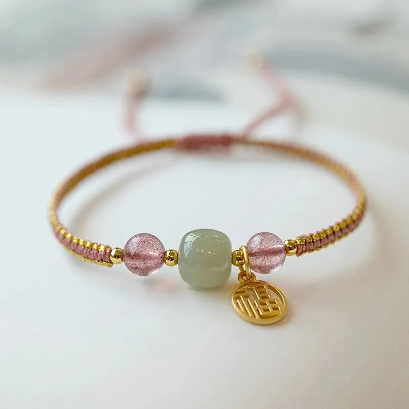 Adjustable red rope bracelet with strawberry quartz transfer beads and sliding knot closure