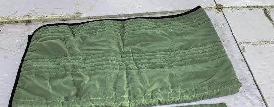 Pure colour seersucker cooling air-conditioning quilt laid flat on a bed
