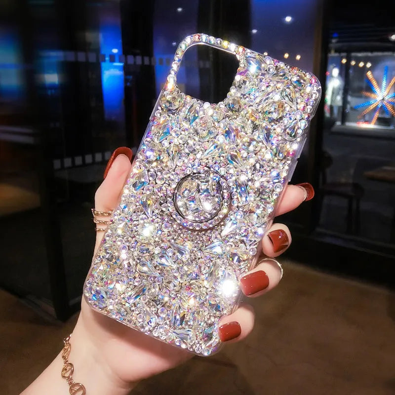 Sparkling diamond acrylic phone case for Samsung Galaxy phone on a table.
