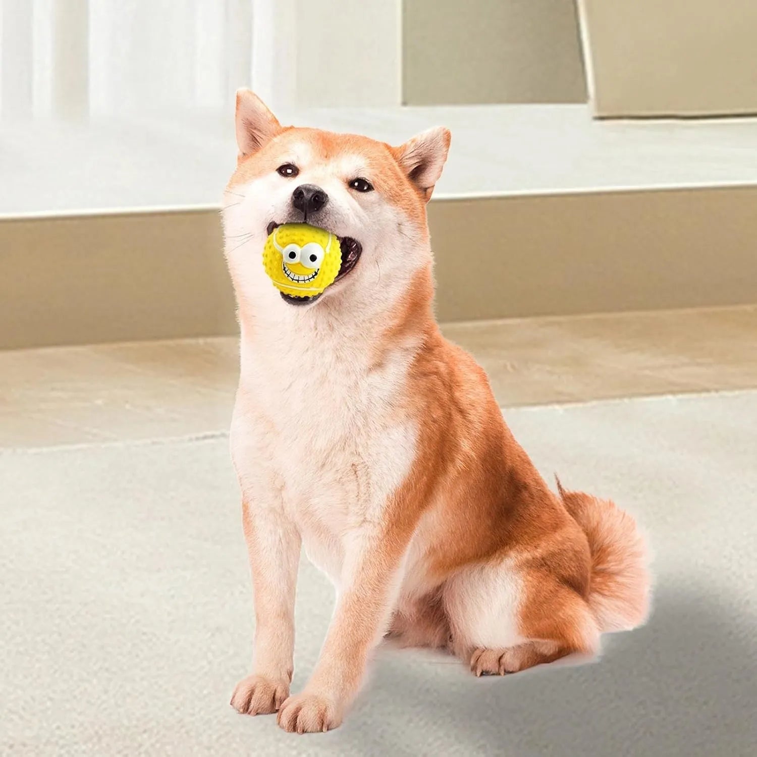 Green latex dog ball with smile face design, suitable for small and medium pets