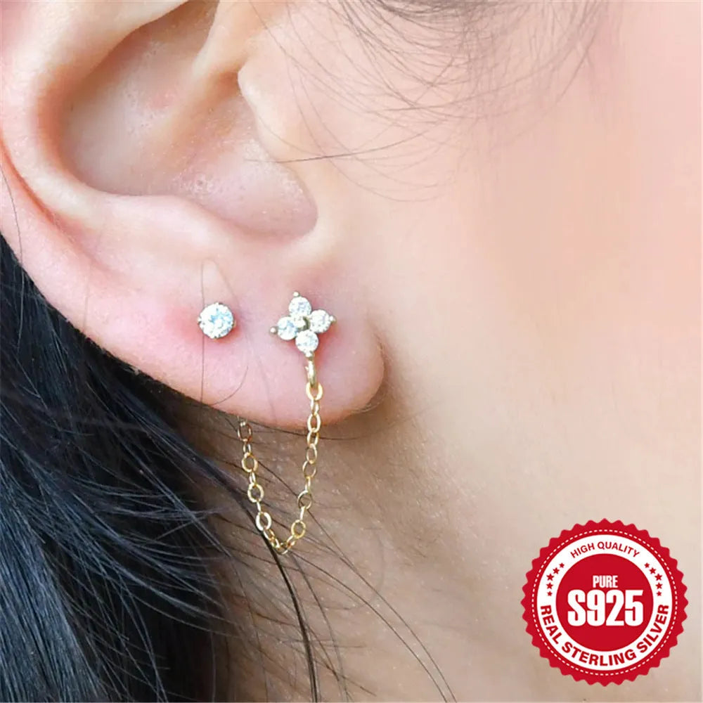S925 sterling silver geometric stud earrings with gold electroplated flower, tassel, and chain design.
