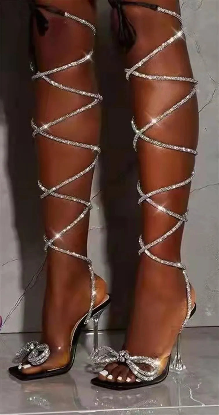 Plus size strappy sandals with rhinestone detail on black background showing square toe and heel