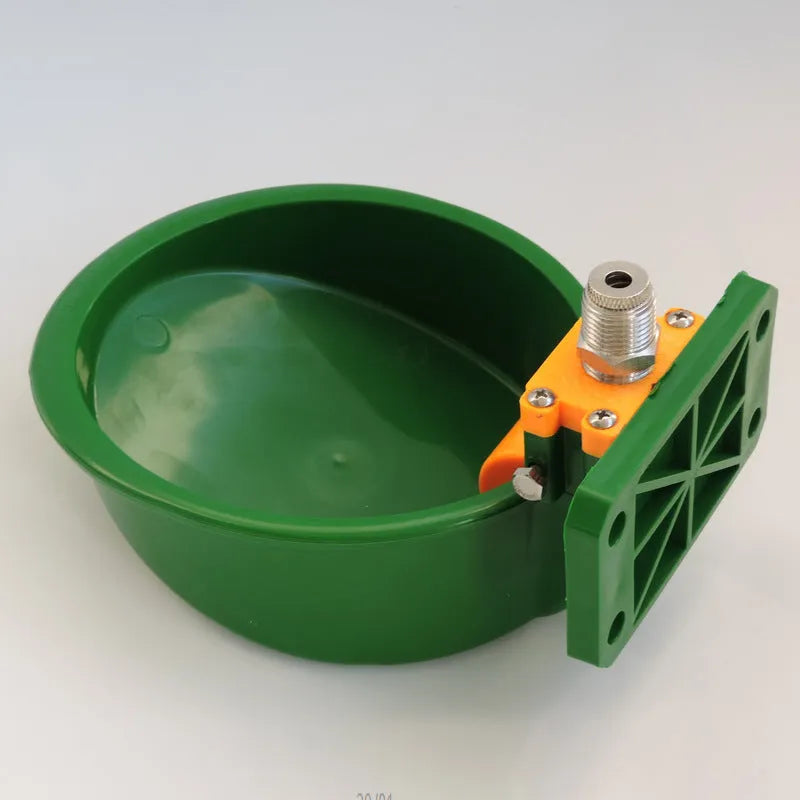 Green plastic drinking bowl for sheep with specialised nozzle design