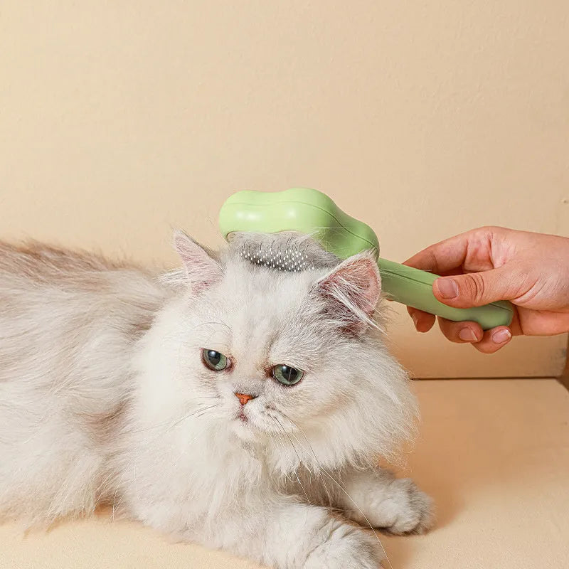 Green or yellow self-cleaning stainless steel cat comb measuring 20cm long