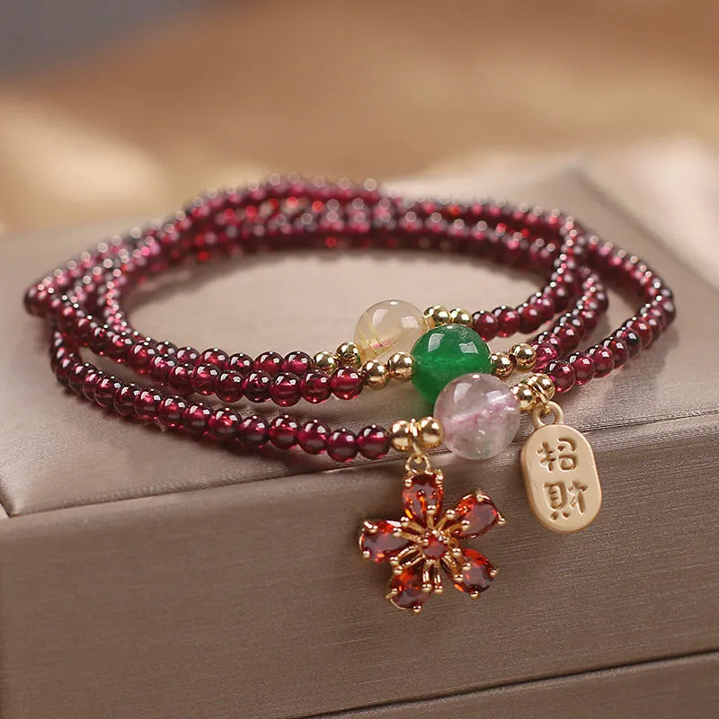 Natural crystal bracelet in pomegranate red and cherry blossom colours with sequin bead accents for women