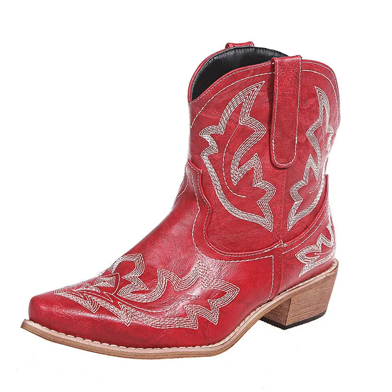 Women's blue embroidered cowboy boots with a low wedge heel and pointed toe.