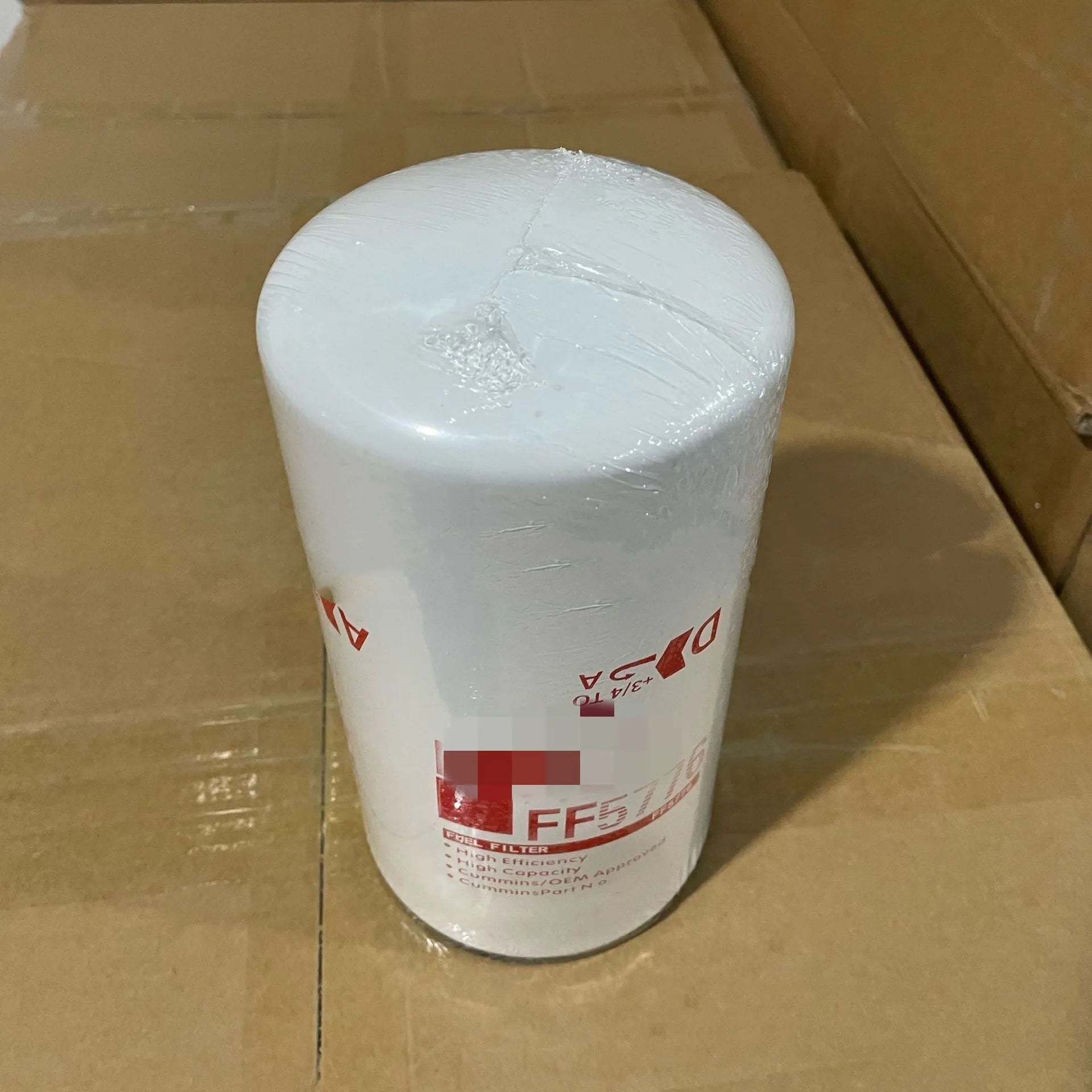 White metal diesel fuel filter element FF5776 with folding design and 2mm inlet/outlet ports.