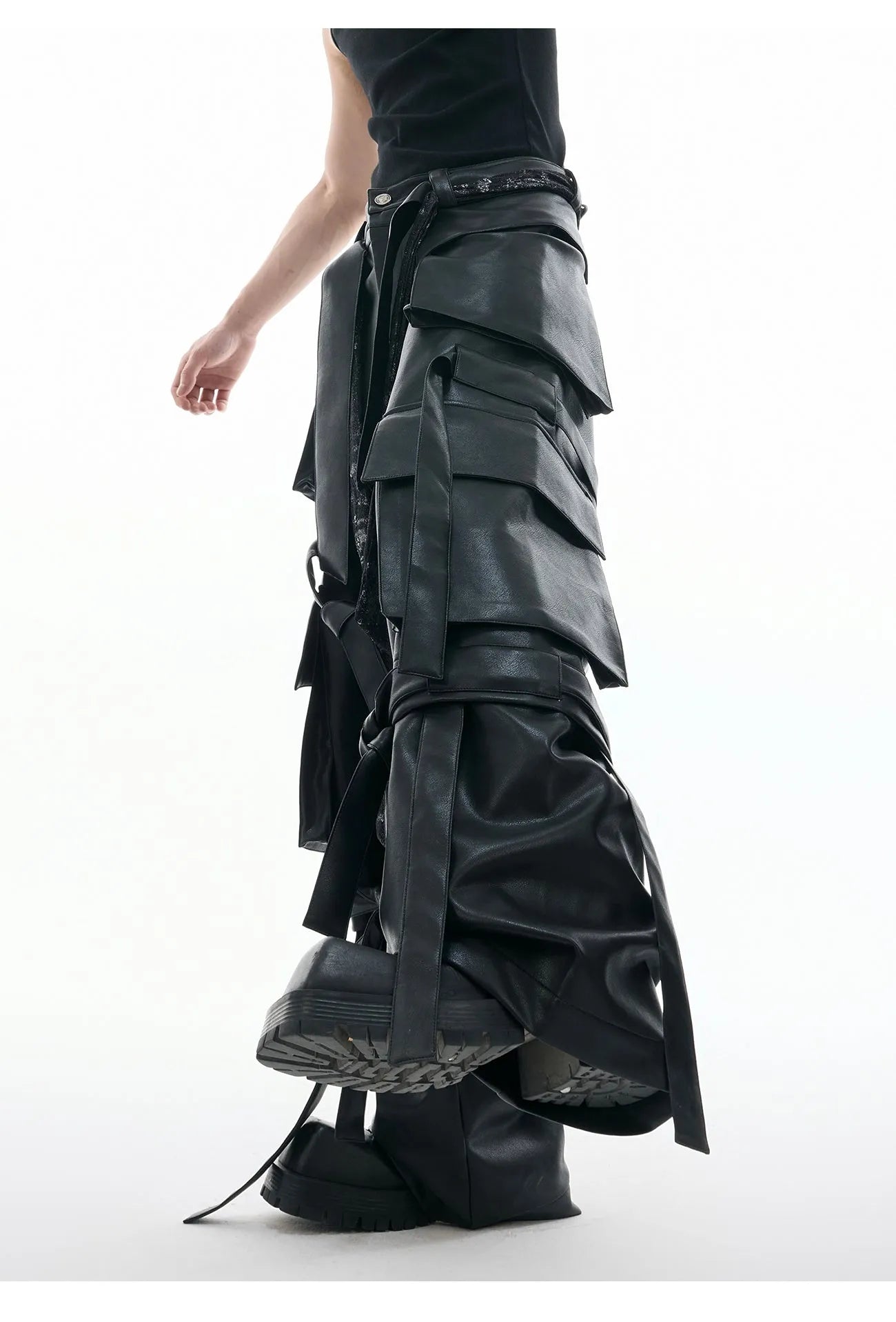 Men's black loose-fit trousers with quilted panels, heavy stitching, and multiple pockets.