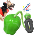 Green plastic dog toy shaped like an apple, functioning as a food-dropping ball and molar chew.