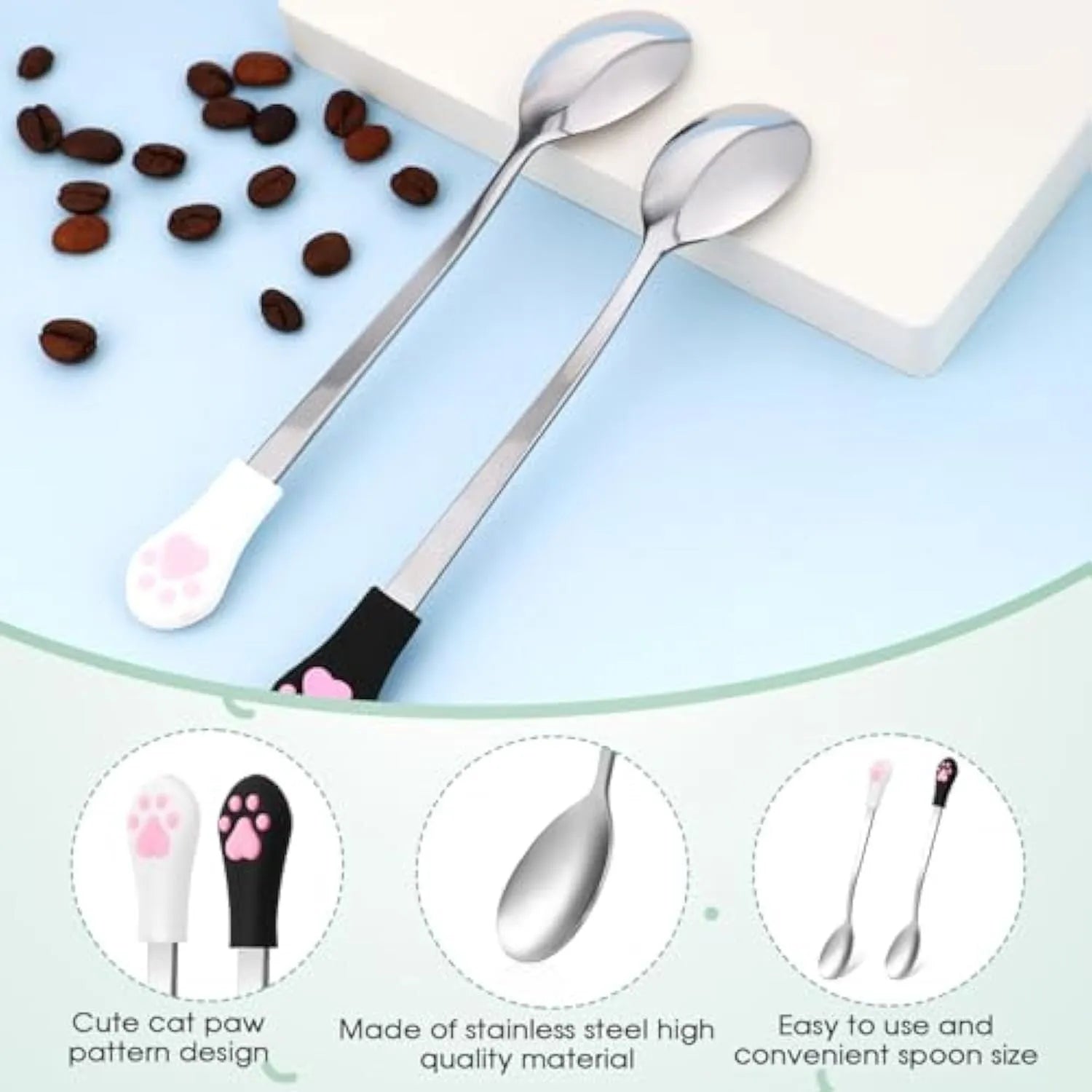 White and black pet food spoons with cat paw design and silicone handles