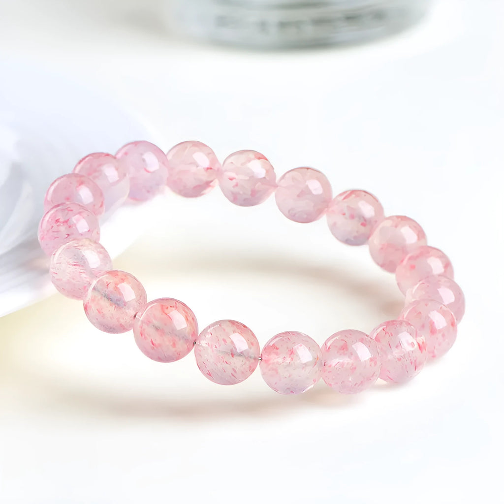 Strawberry quartz crystal ball bracelet with geometric beads measuring 10-10.8mm
