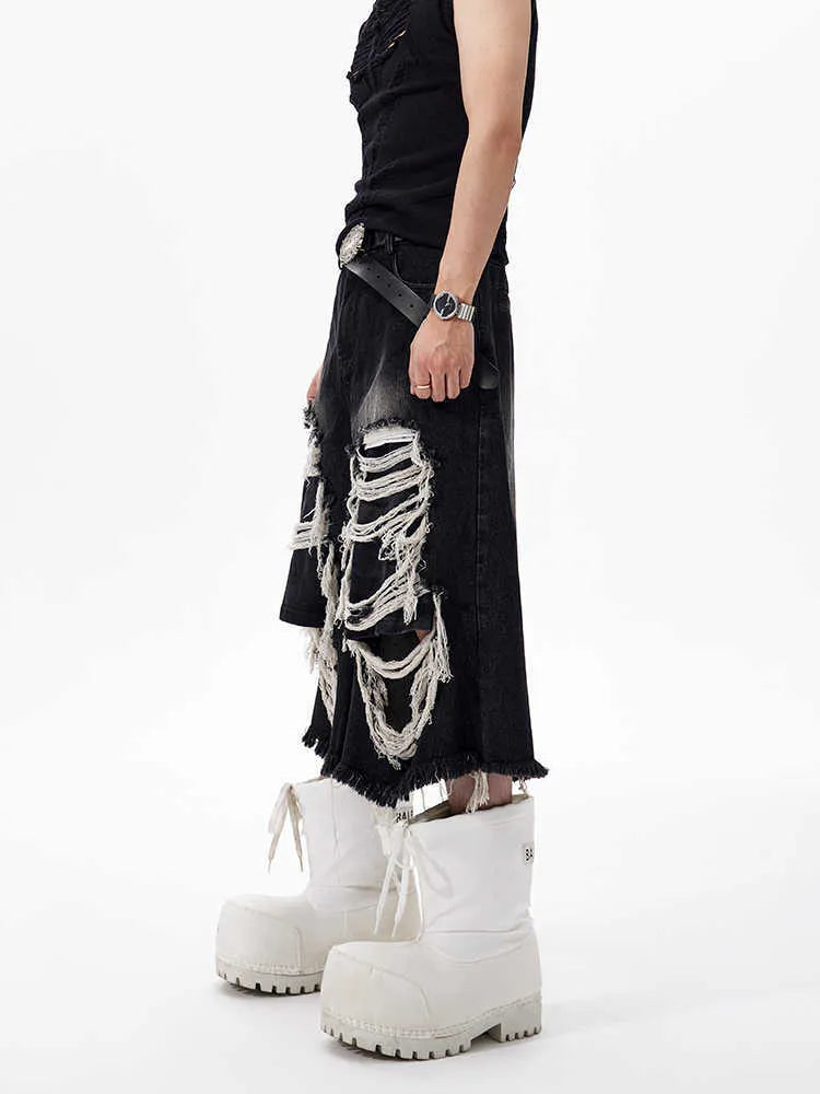 Black women's cropped wide-leg jeans with ripped patch detail and a mid-high waist