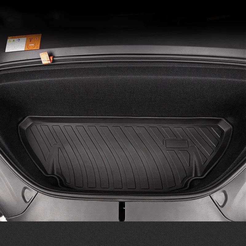Custom rubber floor mats for Tesla cars, showing TPE footrest section and model-specific contours.